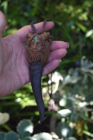 Goat horn pendant with the God Pan