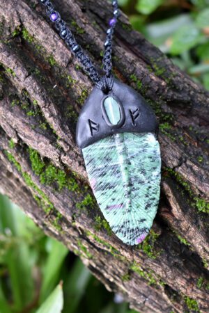 A carved Rubi in Zoisite Feather Pendant